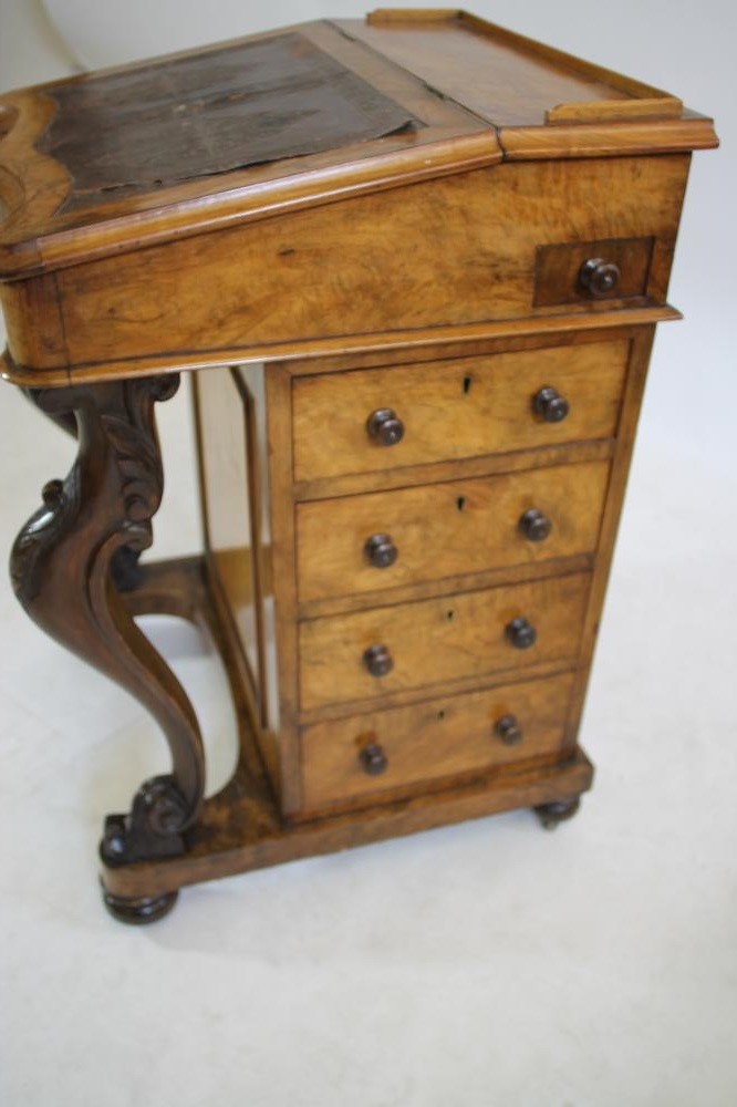 A VICTORIAN WALNUT DAVENPORT Image