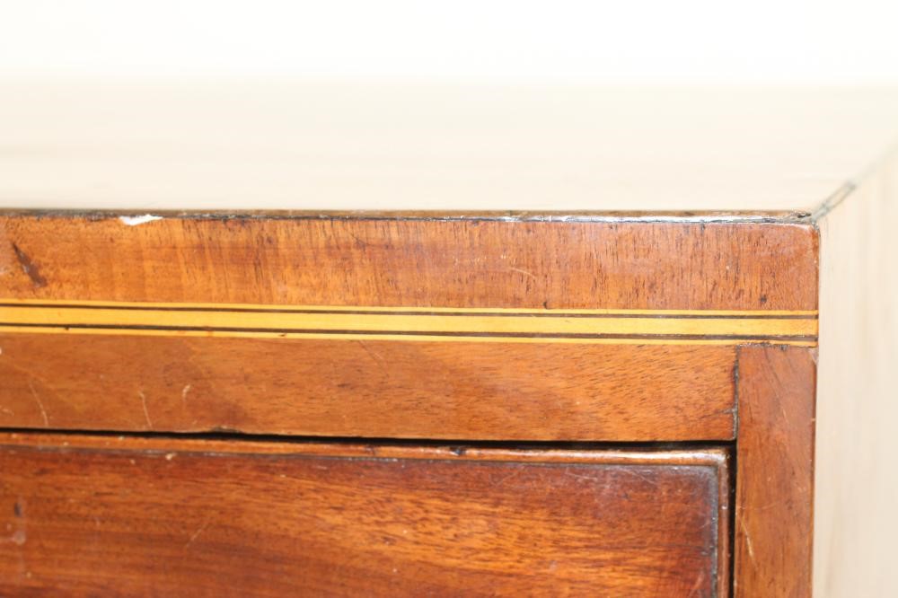A SMALL MAHOGANY CHEST of bowed form with stringing Image