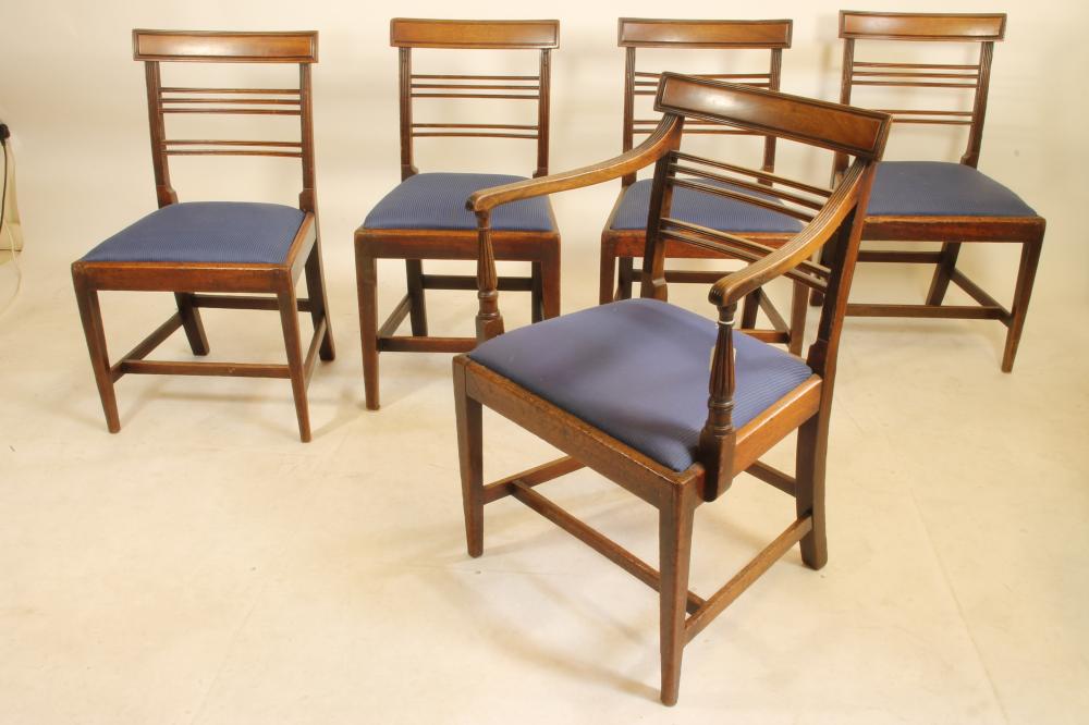 A SET OF FIVE GEORGIAN MAHOGANY DINING CHAIRS including an elbow chair Image