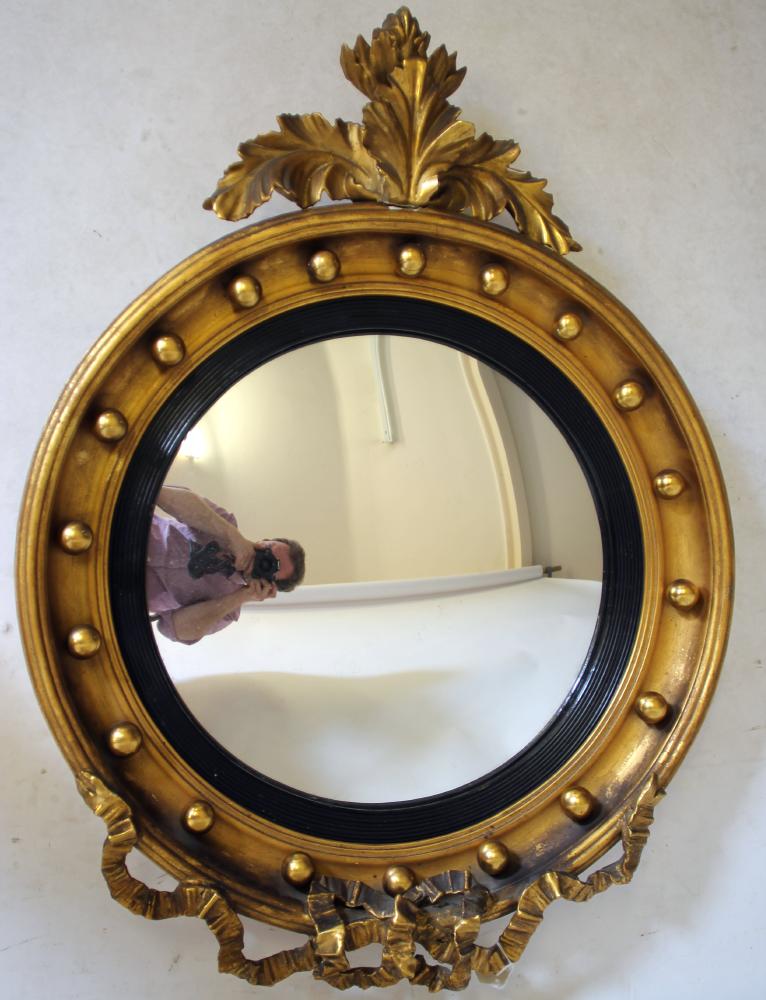 A REGENCY STYLE GILT WOOD CONVEX WALL MIRROR Image