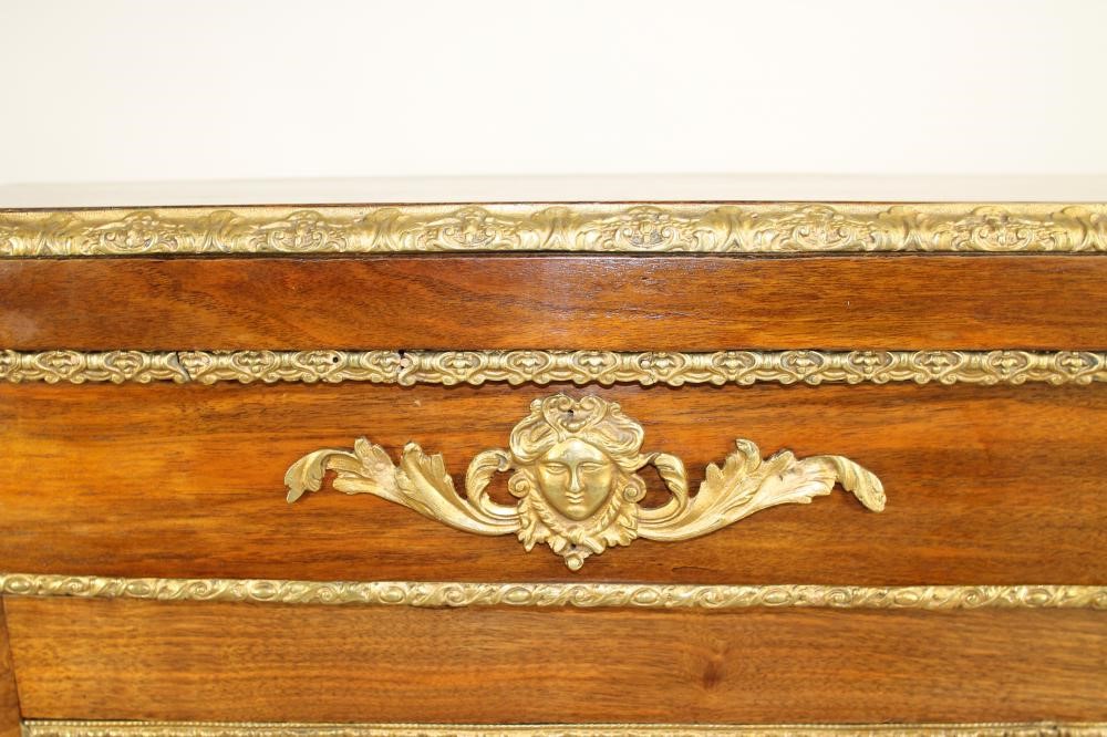 A VICTORIAN WALNUT PIER CABINET of shallow oblong form with gilt metal mounts Image
