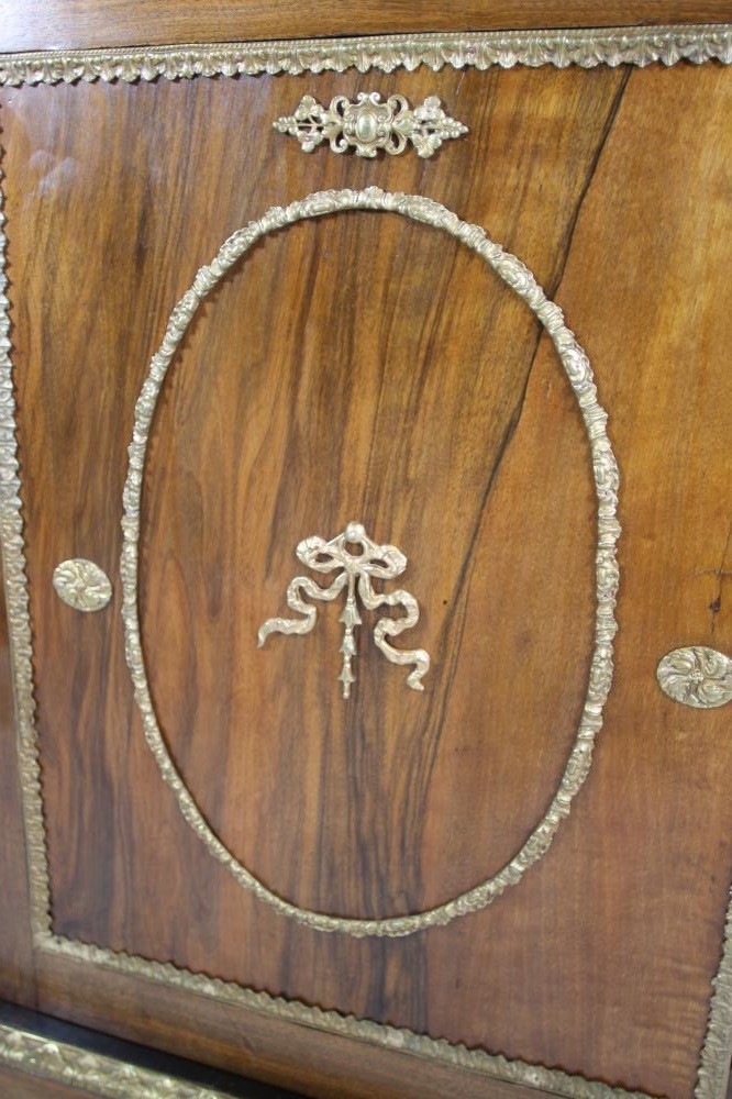 A VICTORIAN WALNUT PIER CABINET of shallow oblong form with gilt metal mounts Image