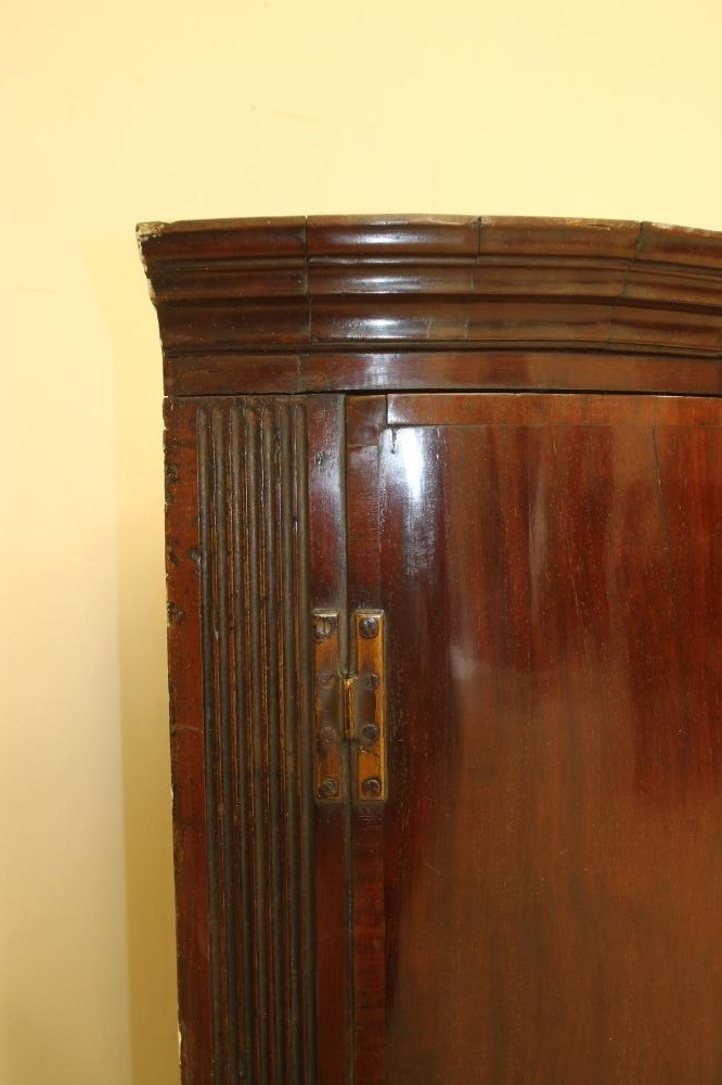 A GEORGIAN MAHOGANY CORNER CUPBOARD Image