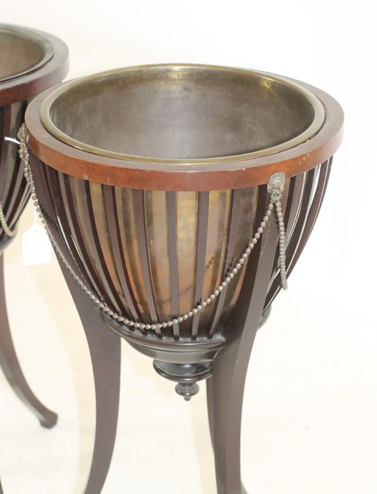 A PAIR OF EDWARDIAN MAHOGANY JARDINIERES by James Shoolbred & Co. Image