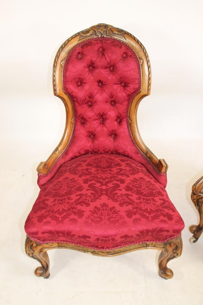 A PAIR OF VICTORIAN CARVED WALNUT SALON CHAIRS FOR A LADY AND GENTLEMAN Image