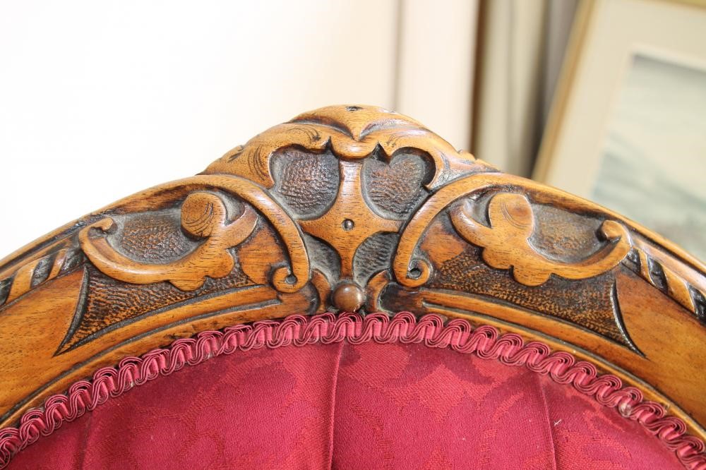 A PAIR OF VICTORIAN CARVED WALNUT SALON CHAIRS FOR A LADY AND GENTLEMAN Image