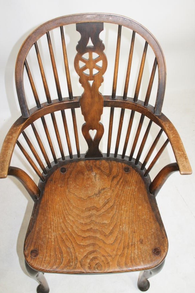 A PAIR OF ASH AND ELM WINDSOR ARMCHAIRS by Waring & Gillow Image