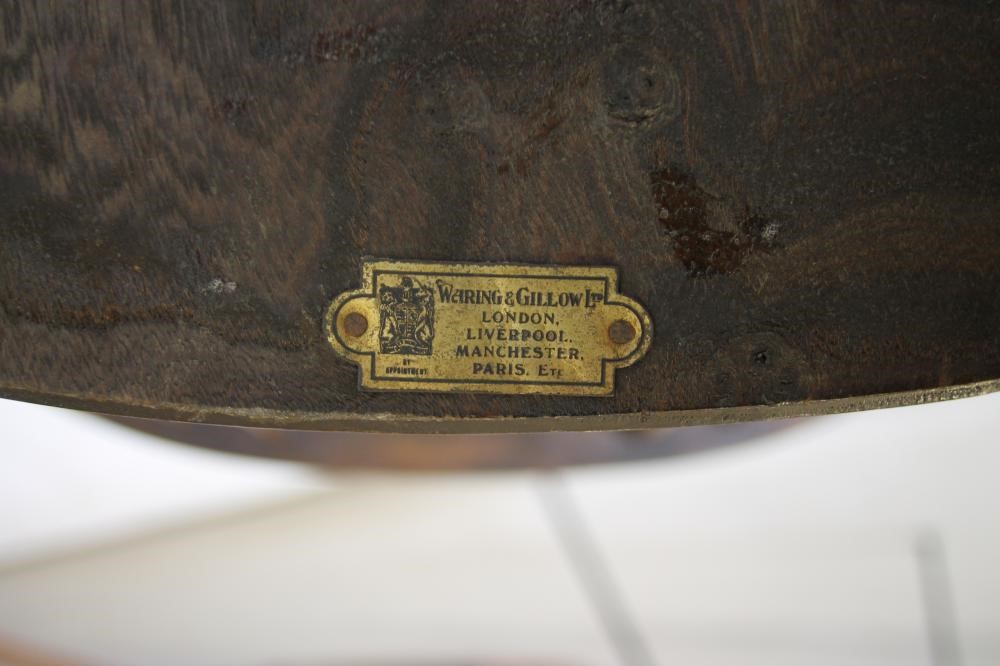A PAIR OF ASH AND ELM WINDSOR ARMCHAIRS by Waring & Gillow Image