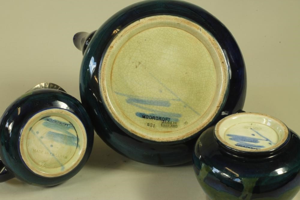 A MOORCROFT POTTERY THREE PIECE TEA SERVICE Image