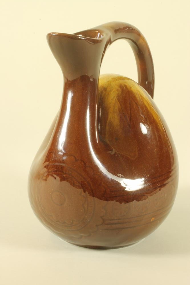 AN EARTHENWARE "CAMEL" JUG Image