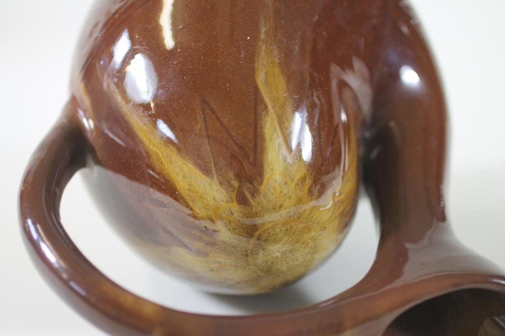 AN EARTHENWARE "CAMEL" JUG Image