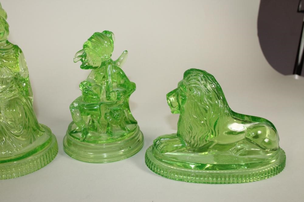 A COLLECTION OF FIVE J. DERBYSHIRE PRESSED GREEN GLASS FIGURES AND MODELS Image