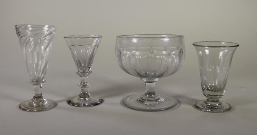 FOUR GEORGIAN AND LATER GLASSES comprising a "Somerset Ale" with wrythen fluted conical bowl Image