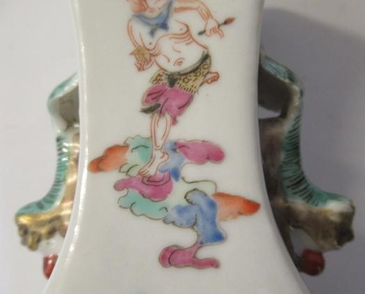 A PAIR OF CHINESE PORCELAIN VASES of baluster square section with shi-shi handles Image