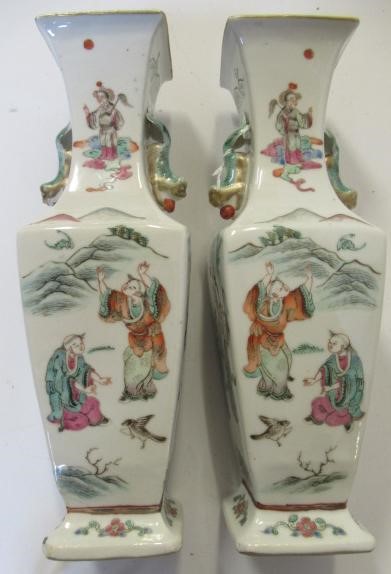 A PAIR OF CHINESE PORCELAIN VASES of baluster square section with shi-shi handles Image