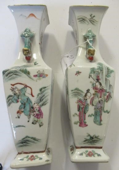 A PAIR OF CHINESE PORCELAIN VASES of baluster square section with shi-shi handles Image