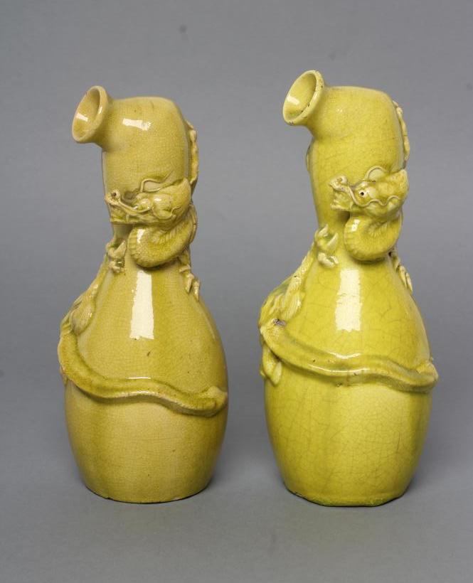 A COMPOSITE PAIR OF CHINESE EARTHENWARE EWERS of double gourd form Image