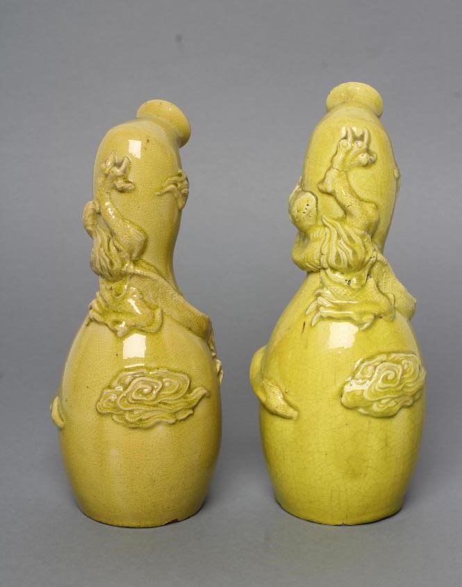 A COMPOSITE PAIR OF CHINESE EARTHENWARE EWERS of double gourd form Image