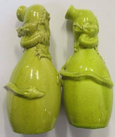 A COMPOSITE PAIR OF CHINESE EARTHENWARE EWERS of double gourd form Image