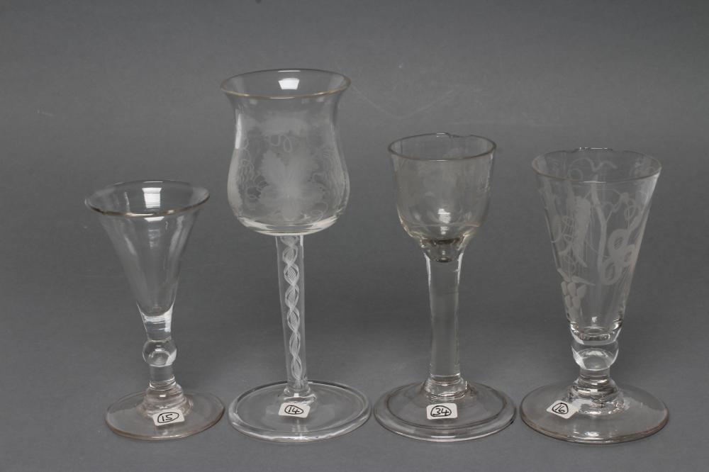 A COLLECTION OF FOUR VARIOUS GLASSES Image
