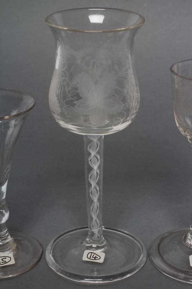 A COLLECTION OF FOUR VARIOUS GLASSES Image