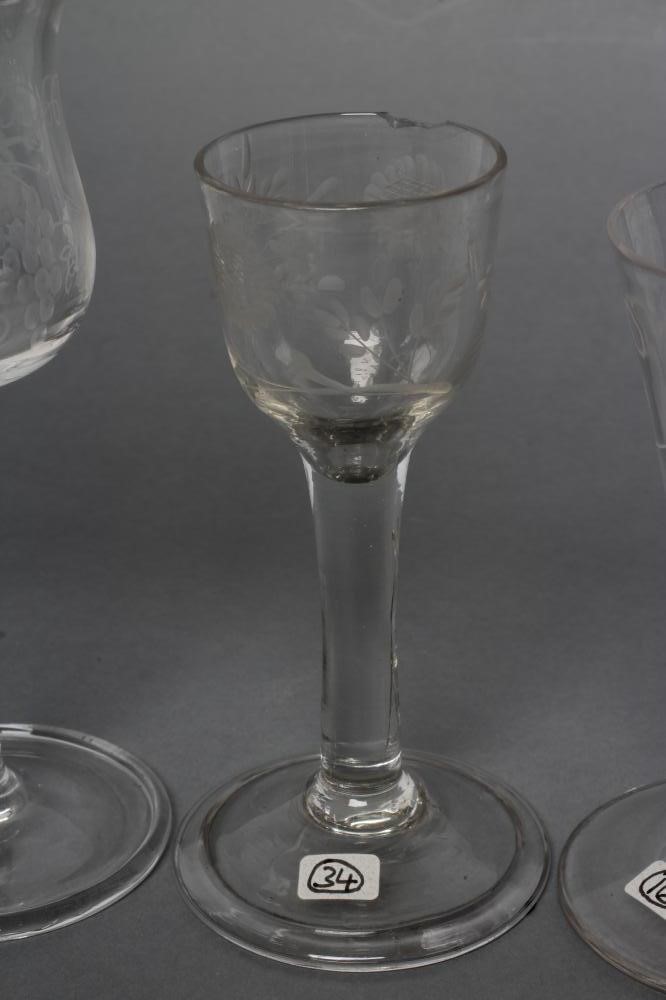 A COLLECTION OF FOUR VARIOUS GLASSES Image