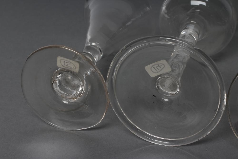 A COLLECTION OF FOUR VARIOUS GLASSES Image