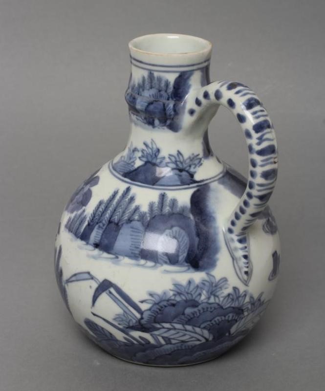 A PORCELAIN EWER of globular form with knopped cylindrical neck and plain loop handle Image