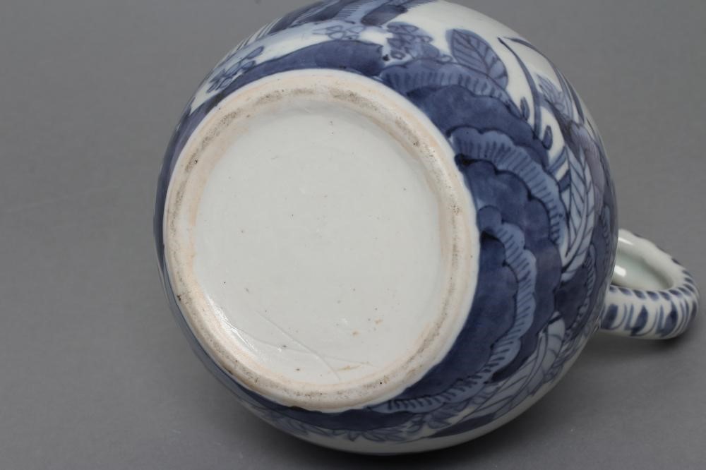 A PORCELAIN EWER of globular form with knopped cylindrical neck and plain loop handle Image