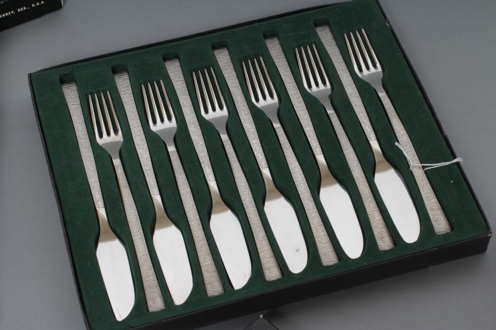 A VINER'S STUDIO STAINLESS STEEL TABLE SERVICE for six place settings by Gerald Benney Image