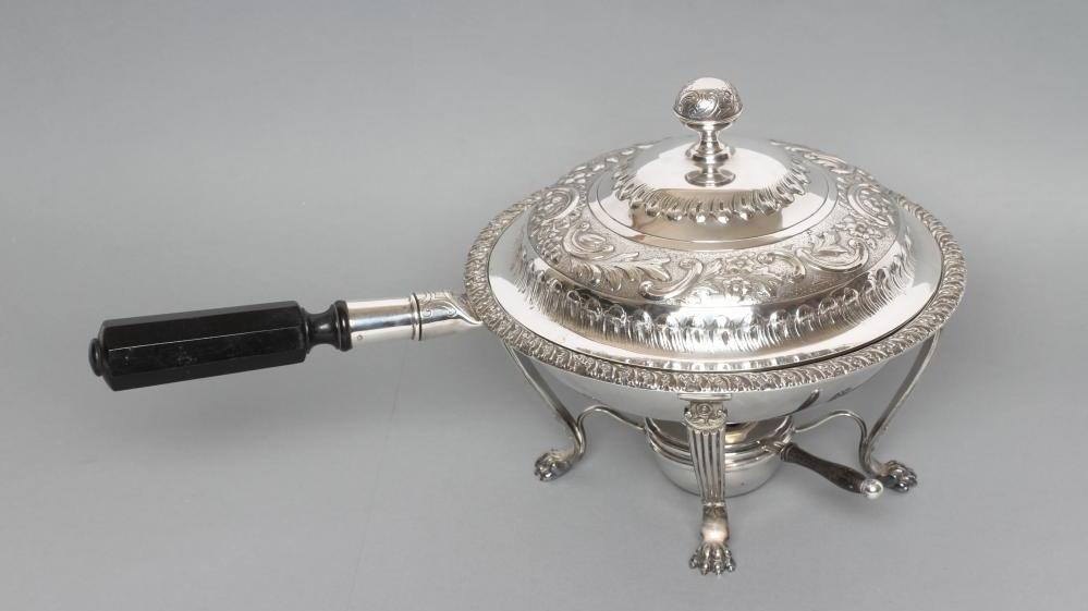AN EDWARDIAN EPNS CHAFING DISH of circular form with everted acanthus leaf rim and angular ebony Image