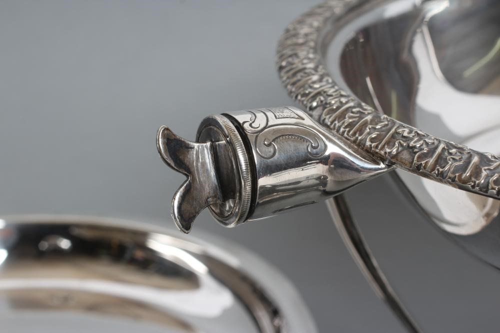 AN EDWARDIAN EPNS CHAFING DISH of circular form with everted acanthus leaf rim and angular ebony Image