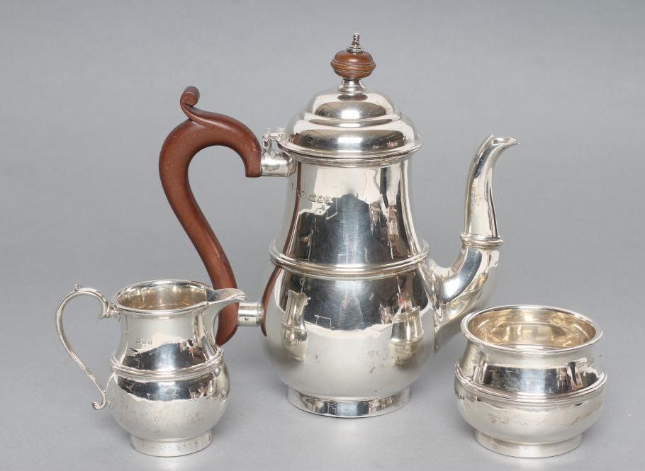 A SILVER THREE PIECE BACHELOR'S TEA SERVICE Image