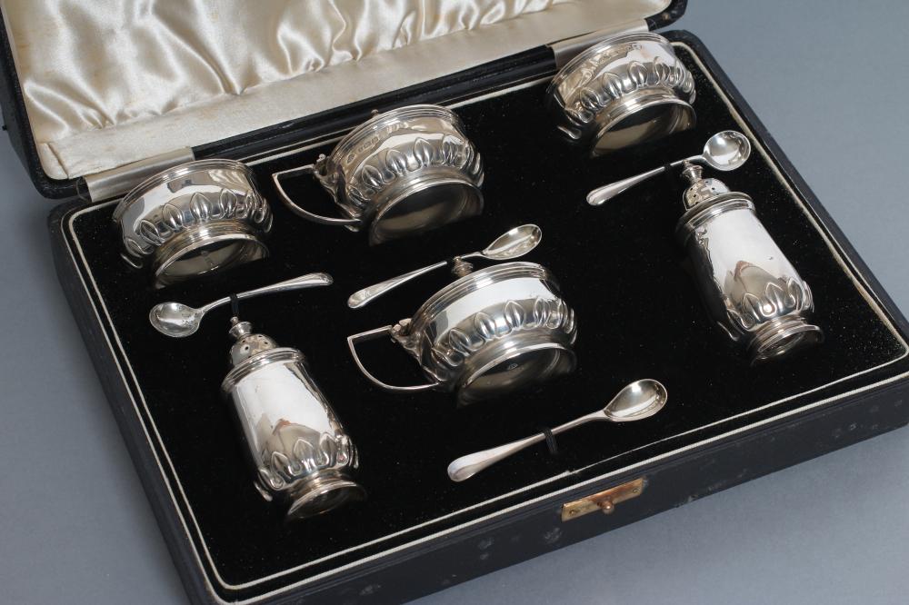 A SILVER COMPOSITE SIX PIECE CRUET Image