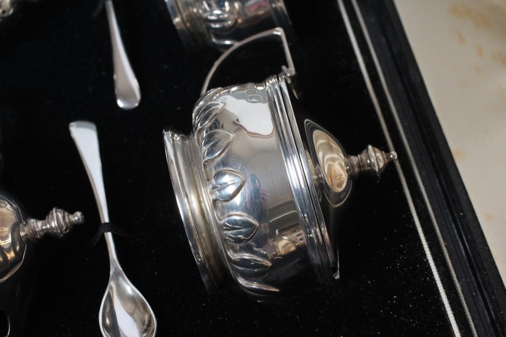 A SILVER COMPOSITE SIX PIECE CRUET Image