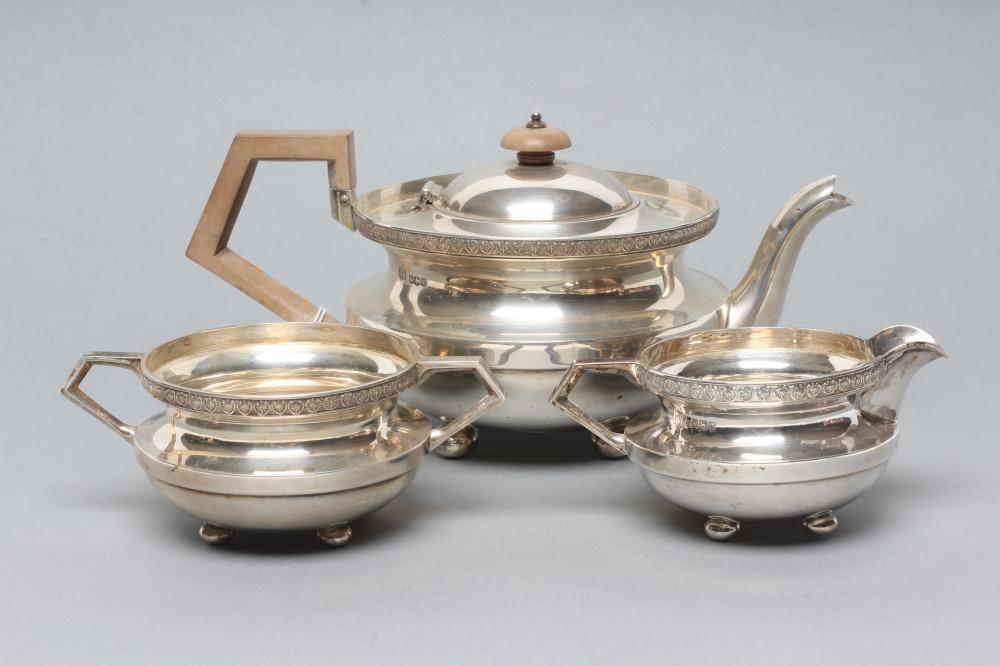 AN ART DECO THREE PIECE SILVER TEA SERVICE Image