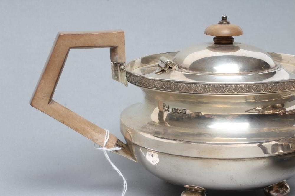 AN ART DECO THREE PIECE SILVER TEA SERVICE Image