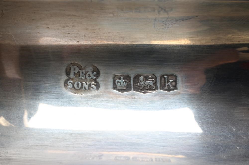 AN ART DECO THREE PIECE SILVER TEA SERVICE Image