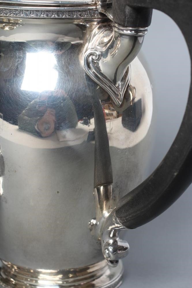 A SILVER TEA AND COFFEE POT Image