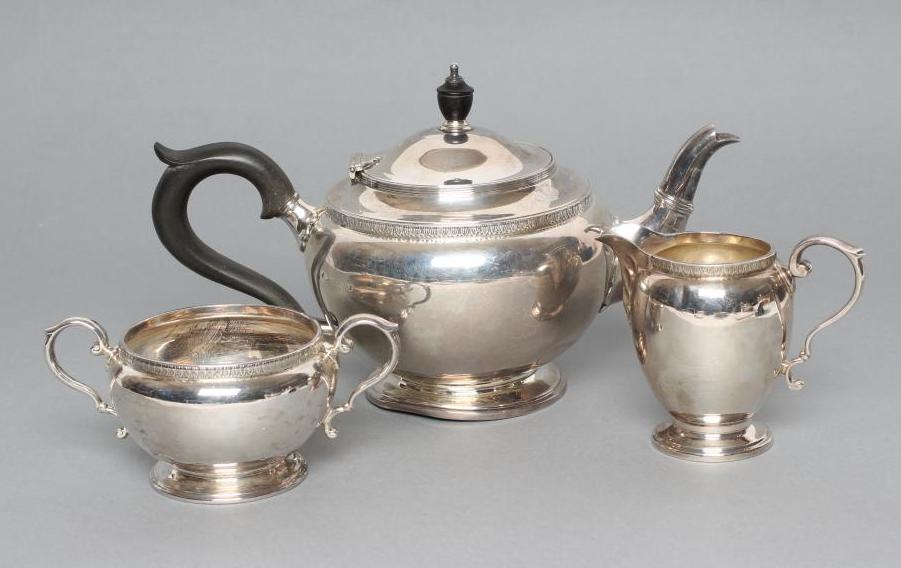 A COMPOSITE THREE PIECE SILVER TEA SERVICE Image