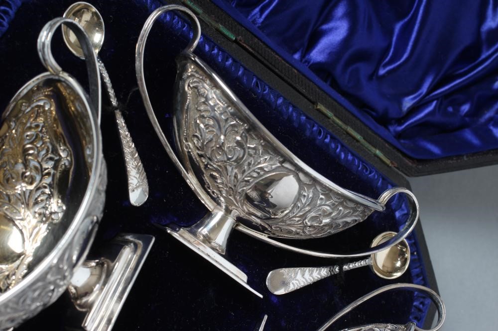 A SET OF FOUR LATE VICTORIAN SILVER PEDESTAL SALTS Image