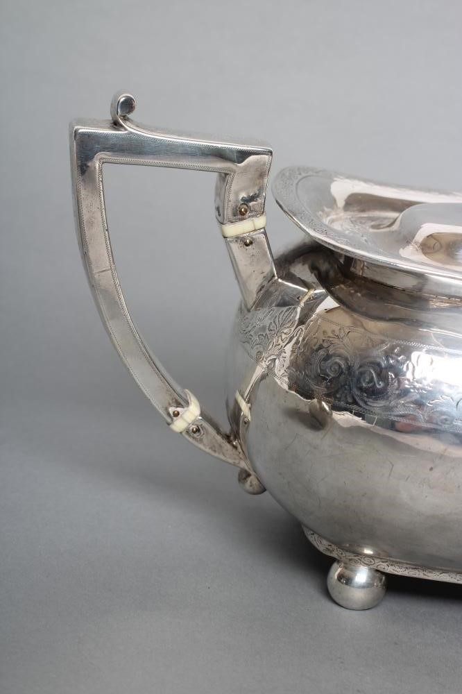 A LATE GEORGE III SILVER MATCHED THREE PIECE TEA SERVICE Image