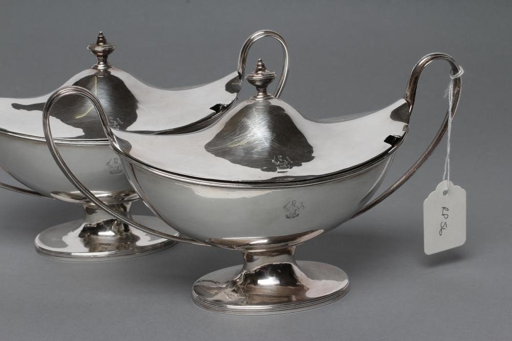 A PAIR OF GEORGE III SILVER SAUCE TUREENS AND COVERS Image
