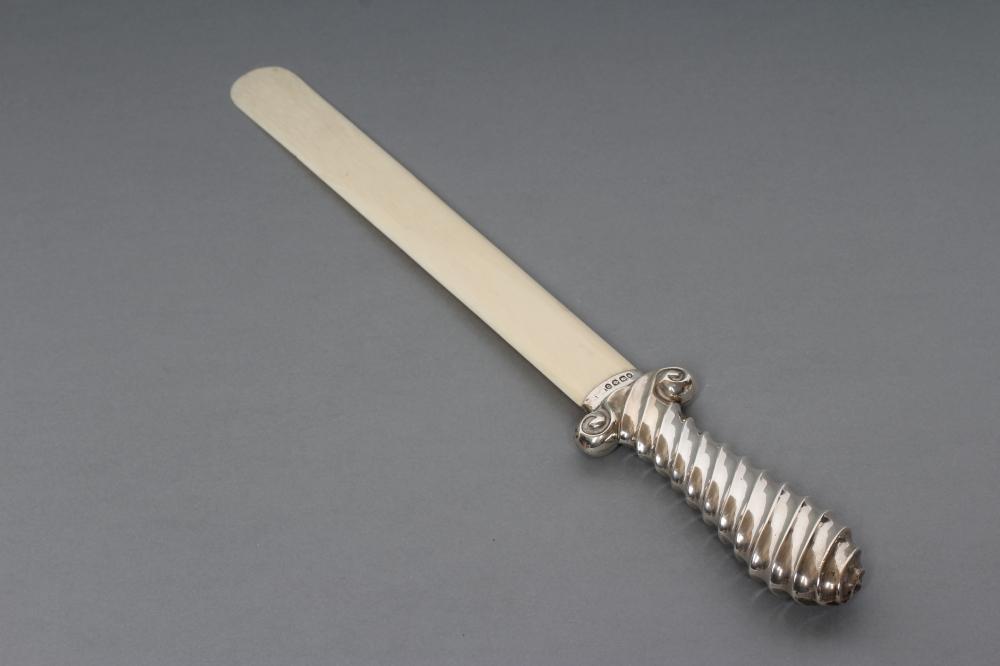 A SILVER MOUNTED IVORY PAGE TURNER Image