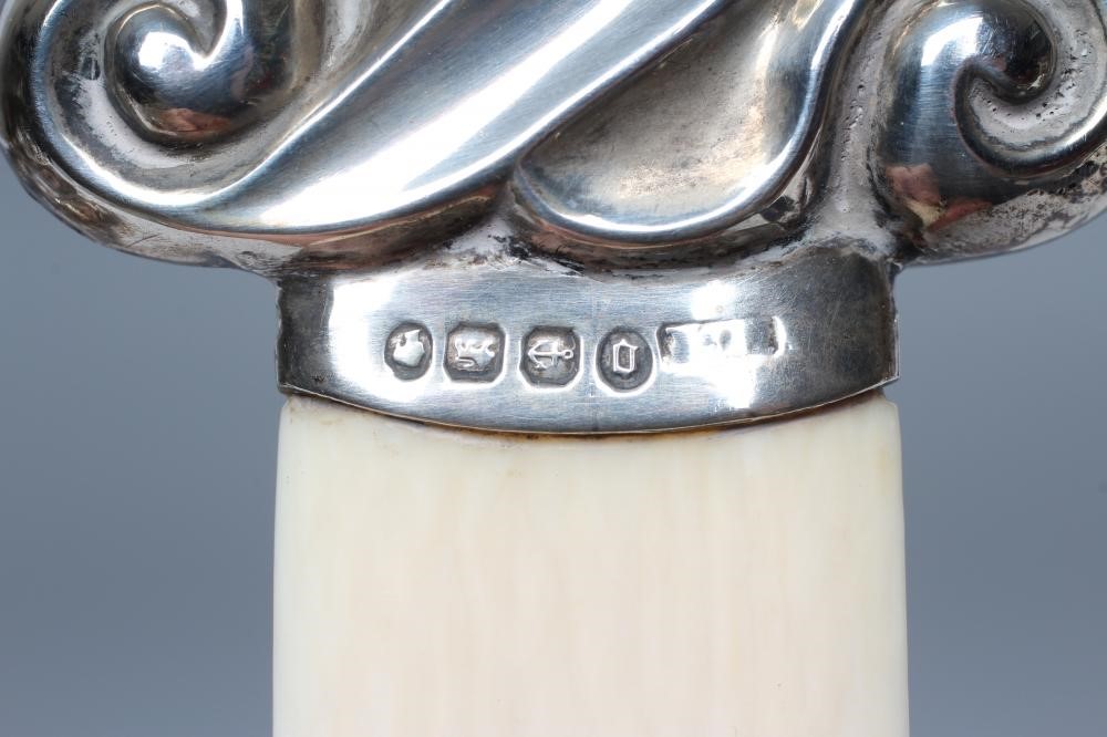 A SILVER MOUNTED IVORY PAGE TURNER Image