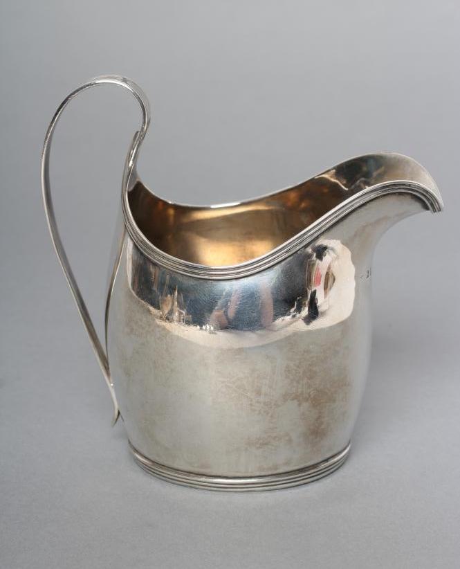A GEORGE III SILVER HELMET JUG Image