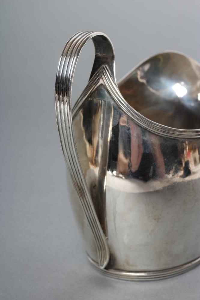 A GEORGE III SILVER HELMET JUG Image
