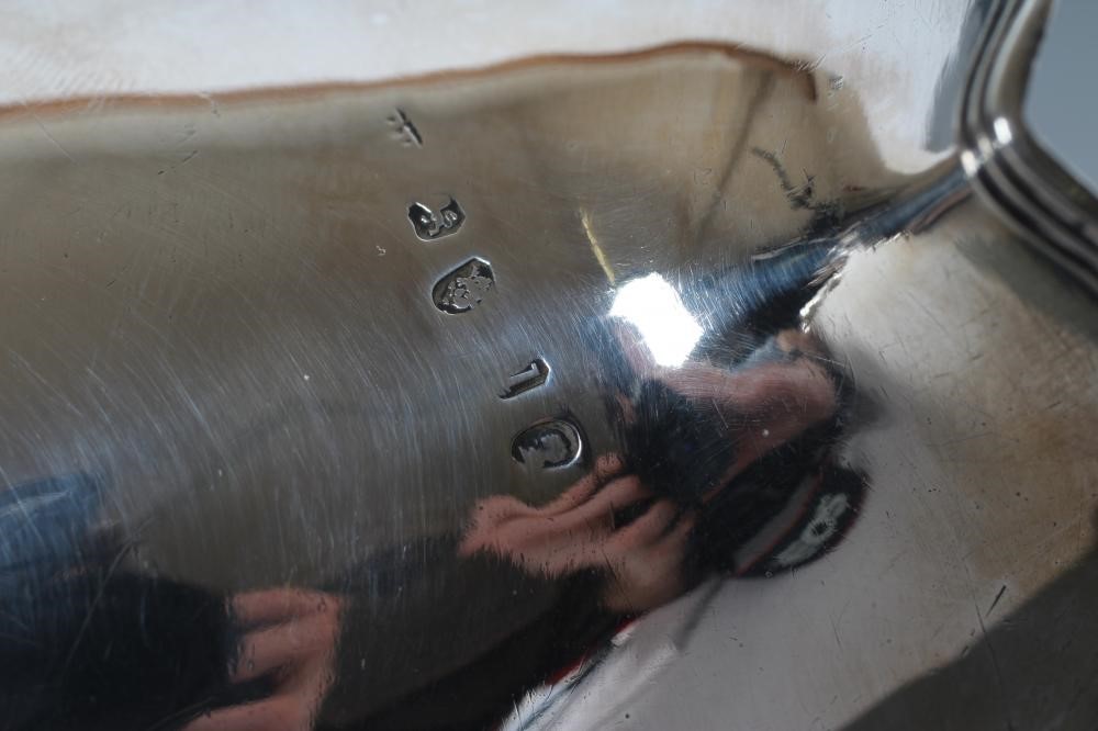 A GEORGE III SILVER HELMET JUG Image