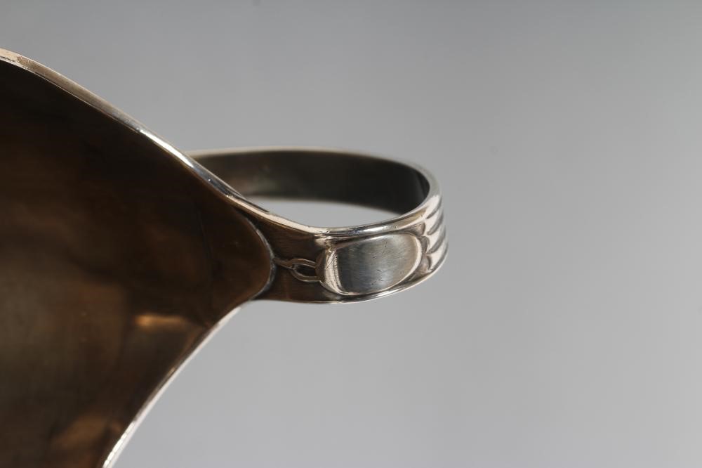 A GEORGE III SILVER HELMET JUG Image