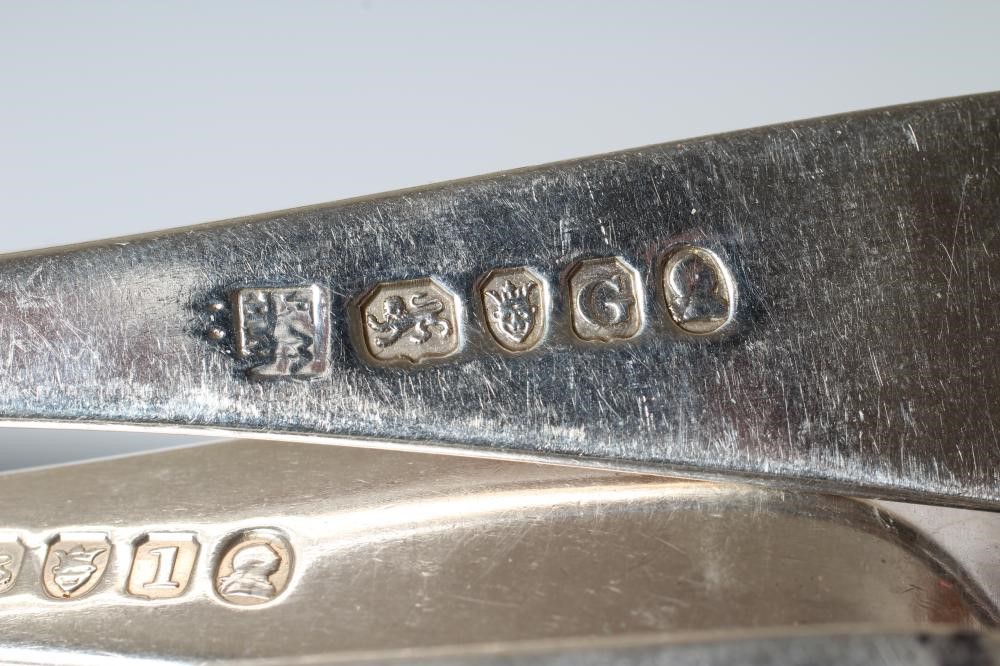 A MATCHED AND COMPOSITE GEORGE III SILVER TABLE SERVICE Image